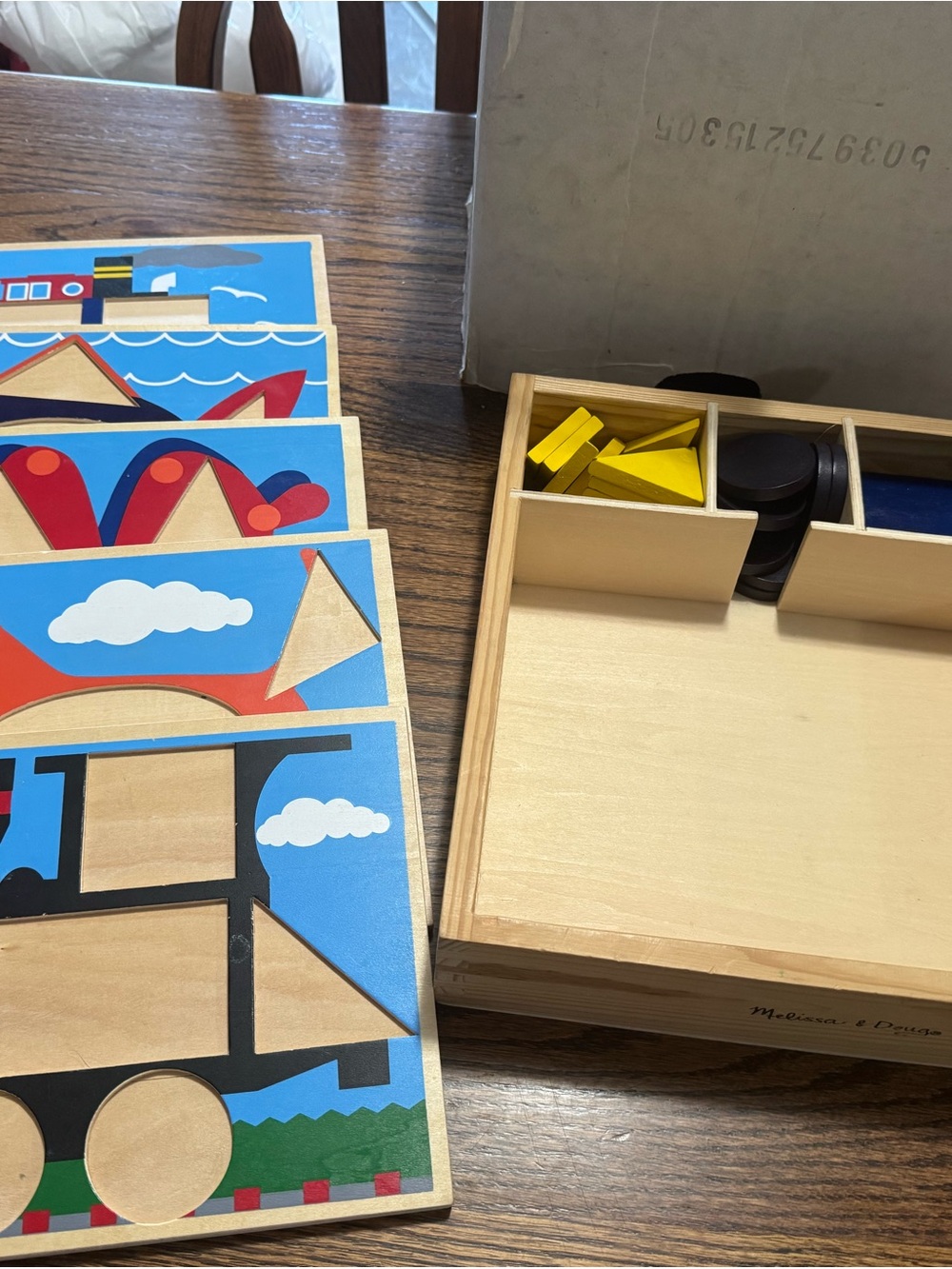 Melissa & Doug Wooden Shape Puzzle Set - Blue, Yellow, Red, Black